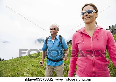 "Couple hiking, Neunerkopfle, Tannheim Valley, Tyrol, Austria, Europe" View Large Photo Image Stock Image - "Couple hiking, Neunerkopfle, Tannheim Valley, Tyrol, Austria, Europe". Fotosearch