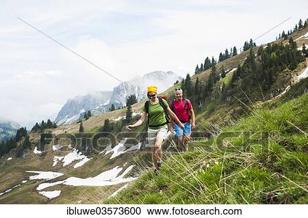 "Couple hiking, Neunerkopfle, Tannheim Valley, Tyrol, Austria, Europe" View Large Photo Image Stock Image - "Couple hiking, Neunerkopfle, Tannheim Valley, Tyrol, Austria, Europe". Fotosearch