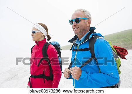 "Couple hiking, Neunerkopfle, Tannheim Valley, Tyrol, Austria, Europe" View Large Photo Image Stock Photograph - "Couple hiking, Neunerkopfle, Tannheim Valley, Tyrol, Austria, Europe". Fotosearch