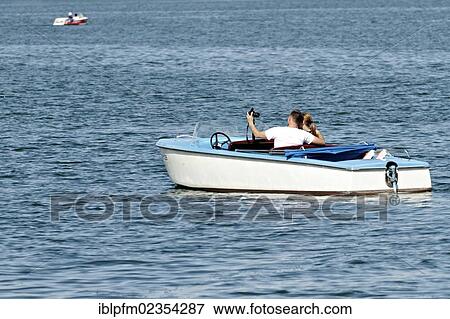 "Couple in a boat taking a self portrait, lake Chiemsee, Upper Bavaria, Germany, Europe" View Large Photo Image Stock Photo - "Couple in a boat taking a self portrait, lake Chiemsee, Upper Bavaria, Germany, Europe". Fotosearch