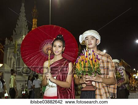 Stock Image - "Couple in traditional costume, parade, Loi Krathong Festival of Lights, Loy, Chiang Mai, Northern Thailand, Thailand, Asia". Fotosearch