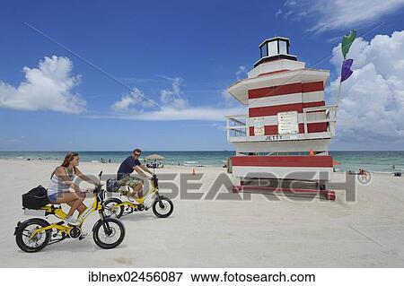 "Couple riding electric bicycles, Watchtower, The Jetty, Miami Rescue Tower, South Beach, Miami, Florida, USA" View Large Photo Image Stock Photo - "Couple riding electric bicycles, Watchtower, The Jetty, Miami Rescue Tower, South Beach, Miami, Florida, USA". Fotosearch