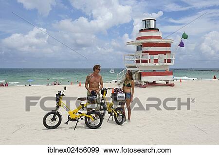 "Couple riding electric bicycles, Watchtower, The Jetty, Miami Rescue Tower, South Beach, Miami, Florida, USA" View Large Photo Image Stock Photo - "Couple riding electric bicycles, Watchtower, The Jetty, Miami Rescue Tower, South Beach, Miami, Florida, USA". Fotosearch