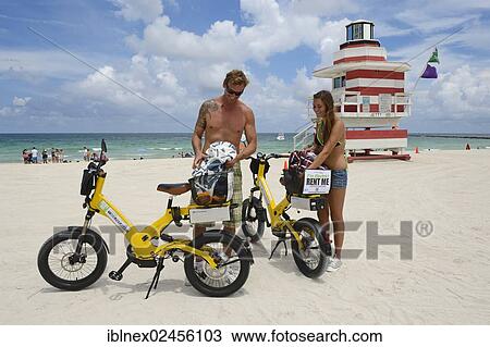 "Couple with electric bicycles, Watchtower, The Jetty, Miami Rescue Tower, South Beach, Miami, Florida, USA" View Large Photo Image Stock Image - "Couple with electric bicycles, Watchtower, The Jetty, Miami Rescue Tower, South Beach, Miami, Florida, USA". Fotosearch