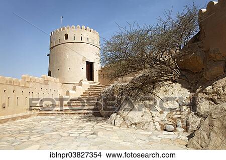 "Courtyard, staircase, defence tower, bushes, Nakhl Fort or Husn Al Heem, fortress, historic mudbrick building, Al-Batinah province, Sultanate of Oman, Arabian Peninsula" View Large Photo Image Picture - "Courtyard, staircase, defence tower, bushes, Nakhl Fort or Husn Al Heem, fortress, historic mudbrick building, Al-Batinah province, Sultanate of Oman, Arabian Peninsula". Fotosearch