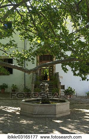Stock Photo - "Courtyard with a fountain, Jardines de Alfabia, Majorca, Balearic Islands, Spain, Europe". Fotosearch