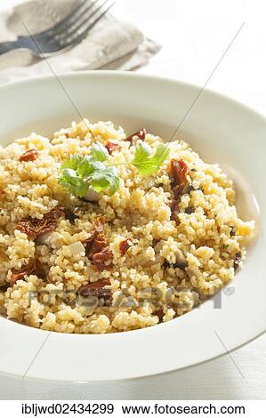 Cous cous with sundried tomatoes and mushrooms View Large Photo Image Stock Photo - Cous cous with sundried tomatoes and mushrooms. Fotosearch