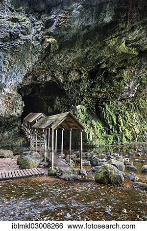 "Covered wooden bridge leads into the partly flooded Smoo Cave limestone cave, Durness, Sutherland County, Highland, Scotland, United Kingdom, Europe" View Large Photo Image Stock Photograph - "Covered wooden bridge leads into the partly flooded Smoo Cave limestone cave, Durness, Sutherland County, Highland, Scotland, United Kingdom, Europe". Fotosearch