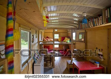 "Cozy corner and a table in the trailer which is used for playing and as a shelter in the forest kindergarten, Ilmmuenster, Bavaria, Germany, Europe" View Large Photo Image Stock Image - "Cozy corner and a table in the trailer which is used for playing and as a shelter in the forest kindergarten, Ilmmuenster, Bavaria, Germany, Europe". Fotosearch