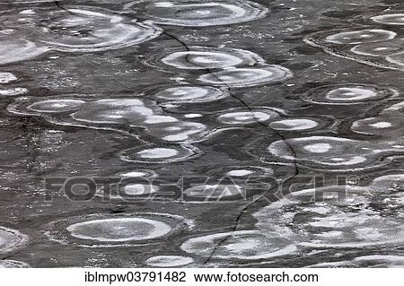 "Crack in an ice surface with annular structures, Switzerland, Europe" View Large Photo Image Stock Image - "Crack in an ice surface with annular structures, Switzerland, Europe". Fotosearch