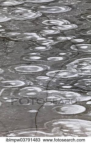 "Crack in an ice surface with annular structures, Switzerland, Europe" View Large Photo Image Stock Image - "Crack in an ice surface with annular structures, Switzerland, Europe". Fotosearch