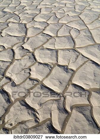 "Cracked soil in a dry pan, Mesquite Flat Sand Dunes, Death Valley, Death Valley National Park, California, USA" View Large Photo Image Stock Photo - "Cracked soil in a dry pan, Mesquite Flat Sand Dunes, Death Valley, Death Valley National Park, California, USA". Fotosearch