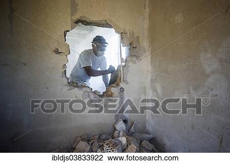 Craftsman during the substantial refurbishment of a building View Large Photo Image Stock Image - Craftsman during the substantial refurbishment of a building. Fotosearch