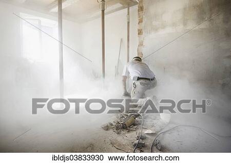 Craftsman during the substantial refurbishment of a building View Large Photo Image Stock Image - Craftsman during the substantial refurbishment of a building. Fotosearch