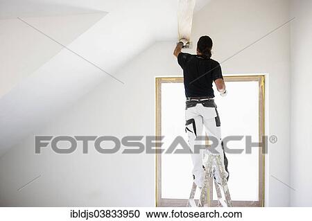 Craftsman plastering the wall of a flat View Large Photo Image Stock Image - Craftsman plastering the wall of a flat. Fotosearch