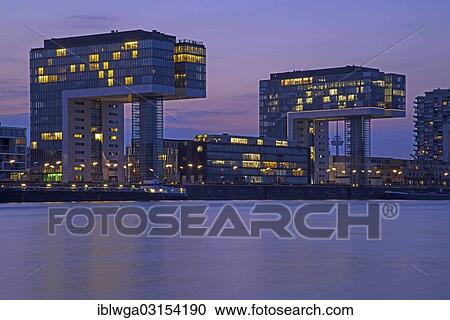 Stock Image - "Crane Buildings at dusk, Cologne, Rhineland, North Rhine-Westphalia, Germany, Europe". Fotosearch