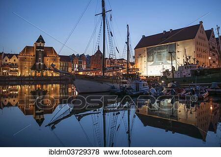 Stock Photo - "Crane Gate or Brama Zuraw in the historic row of houses at dusk, Gdansk, Pomeranian Voivodeship, Poland, Europe". Fotosearch