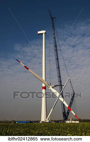 Crane lifting the rotor blades of a new wind turbine, Grevenbroich, North Rhine-Westphalia, Germany, Europe View Large Photo Image Stock Photography - Crane lifting the rotor blades of a new wind turbine, Grevenbroich, North Rhine-Westphalia, Germany, Europe. Fotosearch
