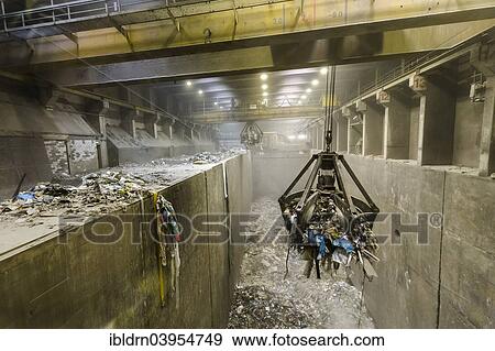 "Crane transporting waste to the incinerators at a waste incineration plant, Essen-Karnap, North Rhine-Westphalia, Germany, Europe" View Large Photo Image Stock Photo - "Crane transporting waste to the incinerators at a waste incineration plant, Essen-Karnap, North Rhine-Westphalia, Germany, Europe". Fotosearch