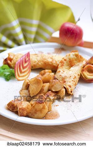 Crepes with caramelised apples View Large Photo Image Stock Photo - Crepes with caramelised apples. Fotosearch