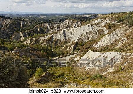 Crete Senesi, literally, Siennese clays, erosion forms of Calanchi near Chiusure, Buonconvento, Tuscany region, province of Siena, Italy, Europe View Large Photo Image Stock Photo - Crete Senesi, literally, Siennese clays, erosion forms of Calanchi near Chiusure, Buonconvento, Tuscany region, province of Siena, Italy, Europe. Fotosearch