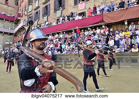 "Cross-bow bearer at the parade before the historical horse race Palio di Siena, Piazza del Campo, Siena, Tuscany, Italy, Europe" View Large Photo Image Stock Photo - "Cross-bow bearer at the parade before the historical horse race Palio di Siena, Piazza del Campo, Siena, Tuscany, Italy, Europe". Fotosearch