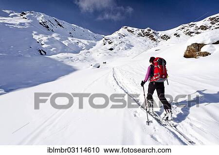Stock Image - "Cross-country skier ascending Wurzer Alpenspitz Mountain in the Ridnauntal Valley, oberhalb von Entholz, South Tyrol province, Trentino-Alto Adige, Italy, Europe". Fotosearch