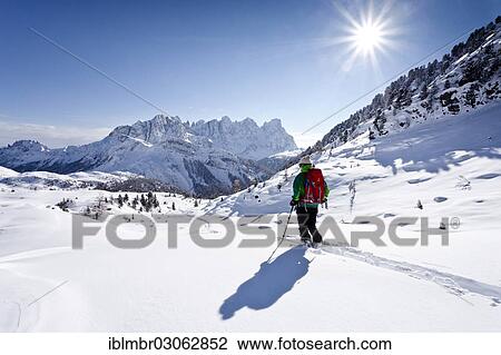 "Cross-country skier descending from Juribrutto, looking over the Passo Valles valley towards the Pala Group, Dolomites, Trentino Province, Trentino-Alto Adige, Italy, Europe" View Large Photo Image Stock Image - "Cross-country skier descending from Juribrutto, looking over the Passo Valles valley towards the Pala Group, Dolomites, Trentino Province, Trentino-Alto Adige, Italy, Europe". Fotosearch