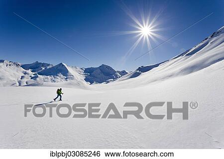 "Cross-country skier in a snowy winter landscape, Ischgl, Silvretta, Tyrol, Austria, Europe" View Large Photo Image Stock Photograph - "Cross-country skier in a snowy winter landscape, Ischgl, Silvretta, Tyrol, Austria, Europe". Fotosearch
