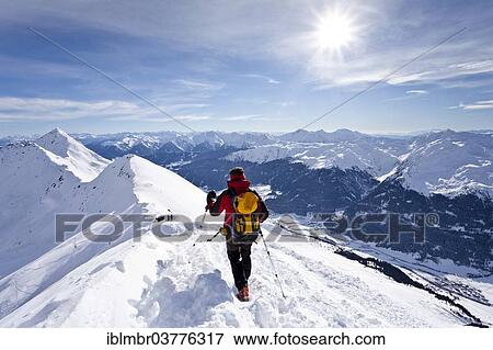 "Cross-country skier on the summit ridge while descending Ellesspitze Mountain, overlooking Ridnauntal Valley, Alto Adige, Italy, Europe" View Large Photo Image Stock Photo - "Cross-country skier on the summit ridge while descending Ellesspitze Mountain, overlooking Ridnauntal Valley, Alto Adige, Italy, Europe". Fotosearch