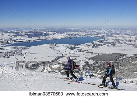"Cross-country skiers on Tegel Mountain, overlooking Forggensee lake, Tegelberg, Ammergauer Alpen, Schwangau, Ostallgau, Allgau, Schwabia, Bavaria, Germany, Europe" View Large Photo Image Stock Image - "Cross-country skiers on Tegel Mountain, overlooking Forggensee lake, Tegelberg, Ammergauer Alpen, Schwangau, Ostallgau, Allgau, Schwabia, Bavaria, Germany, Europe". Fotosearch