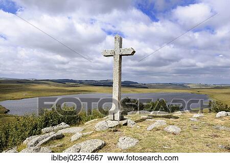 "Cross in the middle of the fields, Saint Andeol lake, Way of St James to Santiago de Compostela, Lozere, Aubrac, France, Europe" View Large Photo Image Stock Photo - "Cross in the middle of the fields, Saint Andeol lake, Way of St James to Santiago de Compostela, Lozere, Aubrac, France, Europe". Fotosearch