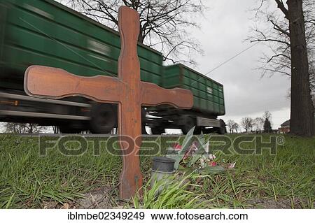 "Cross on the roadside, a truck driving on the road at the back, near Nauen, Havelland region, Brandenburg, Germany, Europe" View Large Photo Image Stock Photo - "Cross on the roadside, a truck driving on the road at the back, near Nauen, Havelland region, Brandenburg, Germany, Europe". Fotosearch