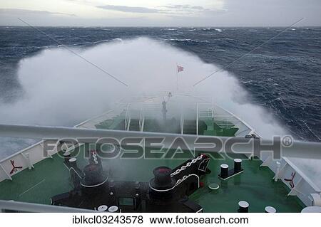"Crossing of the Drake Passage, a big wave is breaking over the bow of the MS Expedition, expedition cruise ship, Atlantic Ocean, Pazifischer Ozean, Sudlicher Ozean, Antarctica" View Large Photo Image Stock Photo - "Crossing of the Drake Passage, a big wave is breaking over the bow of the MS Expedition, expedition cruise ship, Atlantic Ocean, Pazifischer Ozean, Sudlicher Ozean, Antarctica". Fotosearch