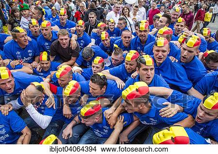 "Crowd with the Belgian flag as a mask on their heads, Doudou city festival in Grand Place square, Mons, Belgium, Europe" View Large Photo Image Picture - "Crowd with the Belgian flag as a mask on their heads, Doudou city festival in Grand Place square, Mons, Belgium, Europe". Fotosearch