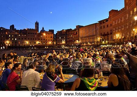 "Crowded tables of the restaurants on the track of the Palio di Siena after the race, Piazza del Campo, Siena, Tuscany, Italy, Europe" View Large Photo Image Stock Photo - "Crowded tables of the restaurants on the track of the Palio di Siena after the race, Piazza del Campo, Siena, Tuscany, Italy, Europe". Fotosearch