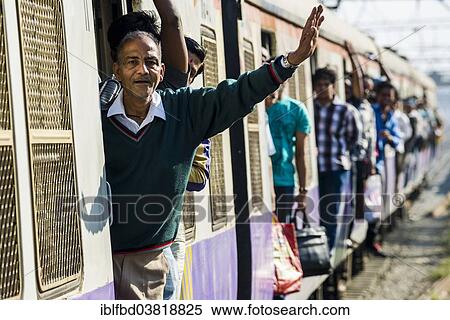 Stock Photography - "Crowded train arriving at Churchgate Railway Station, Mumbai, Maharashtra, India, Asia". Fotosearch