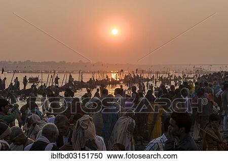 "Crowds of people gathering on the Sangam, the confluence of the rivers Ganges, Yamuna and Saraswati, for the holy bath at sunset, Kumbha Mela mass Hindu pilgrimage, Allahabad, Uttar Pradesh, India, Asia" View Large Photo Image Stock Image - "Crowds of people gathering on the Sangam, the confluence of the rivers Ganges, Yamuna and Saraswati, for the holy bath at sunset, Kumbha Mela mass Hindu pilgrimage, Allahabad, Uttar Pradesh, India, Asia". Fotosearch