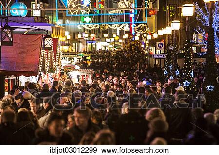 "Crowds of people shoving through shops and Christmas market stalls, pedestrian zone in the city centre of Essen, Essen, North Rhine-Westphalia, Germany, Europe" View Large Photo Image Stock Photo - "Crowds of people shoving through shops and Christmas market stalls, pedestrian zone in the city centre of Essen, Essen, North Rhine-Westphalia, Germany, Europe". Fotosearch