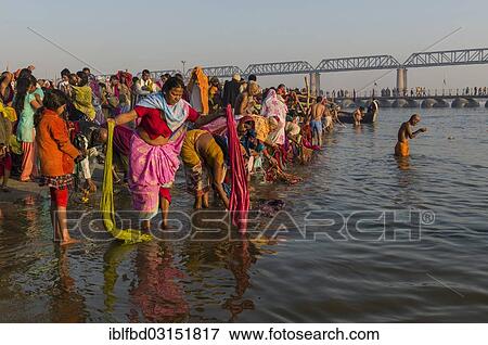 "Crowds of people taking a bath in the Sangam, the confluence of the rivers Ganges, Yamuna and Saraswati, in the early morning, Kumbha Mela mass Hindu pilgrimage, Allahabad, Uttar Pradesh, India, Asia" View Large Photo Image Stock Photo - "Crowds of people taking a bath in the Sangam, the confluence of the rivers Ganges, Yamuna and Saraswati, in the early morning, Kumbha Mela mass Hindu pilgrimage, Allahabad, Uttar Pradesh, India, Asia". Fotosearch