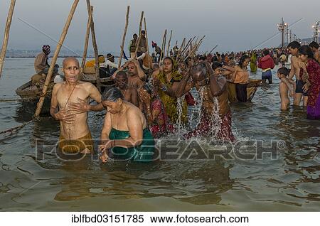 Stock Photography - "Crowds of people taking a bath in the Sangam, the confluence of the rivers Ganges, Yamuna and Saraswati, Kumbha Mela mass Hindu pilgrimage, Allahabad, Uttar Pradesh, India, Asia". Fotosearch