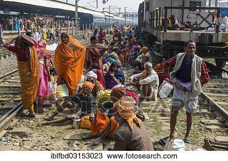 "Crowds of people waiting for delayed trains all over the railway station, Allahabad, Uttar Pradesh, India, Asia" View Large Photo Image Stock Image - "Crowds of people waiting for delayed trains all over the railway station, Allahabad, Uttar Pradesh, India, Asia". Fotosearch