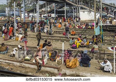 "Crowds of people waiting for delayed trains all over the railway station, Allahabad, Uttar Pradesh, India, Asia" View Large Photo Image Stock Photography - "Crowds of people waiting for delayed trains all over the railway station, Allahabad, Uttar Pradesh, India, Asia". Fotosearch