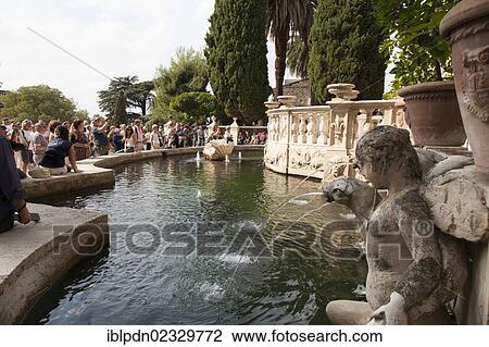 "Crowds of tourists around the Fountain of the Organ at Villa d'Este gardens, Tivoli, Lazio, Italy, Europe" View Large Photo Image Stock Image - "Crowds of tourists around the Fountain of the Organ at Villa d'Este gardens, Tivoli, Lazio, Italy, Europe". Fotosearch