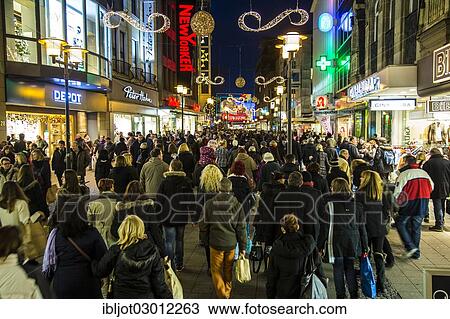 "Crowds thronging between stores and Christmas market stalls, pedestrian street in the centre of Essen, Kettwiger Strasse, Essen, North Rhine-Westphalia, Germany, Europe" View Large Photo Image Stock Image - "Crowds thronging between stores and Christmas market stalls, pedestrian street in the centre of Essen, Kettwiger Strasse, Essen, North Rhine-Westphalia, Germany, Europe". Fotosearch