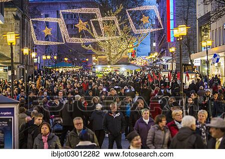 "Crowds thronging between stores and Christmas market stalls, pedestrian street in the centre of Essen, Kettwiger Strasse, Essen, North Rhine-Westphalia, Germany, Europe" View Large Photo Image Stock Image - "Crowds thronging between stores and Christmas market stalls, pedestrian street in the centre of Essen, Kettwiger Strasse, Essen, North Rhine-Westphalia, Germany, Europe". Fotosearch