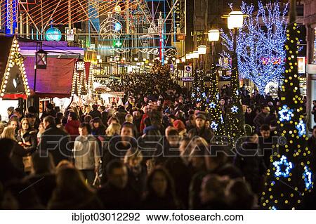 "Crowds thronging between stores and Christmas market stalls, pedestrian street in the centre of Essen, view from Willy-Brandt-Platz towards Kettwiger Strasse, Essen, North Rhine-Westphalia, Germany, Europe" View Large Photo Image Stock Image - "Crowds thronging between stores and Christmas market stalls, pedestrian street in the centre of Essen, view from Willy-Brandt-Platz towards Kettwiger Strasse, Essen, North Rhine-Westphalia, Germany, Europe". Fotosearch
