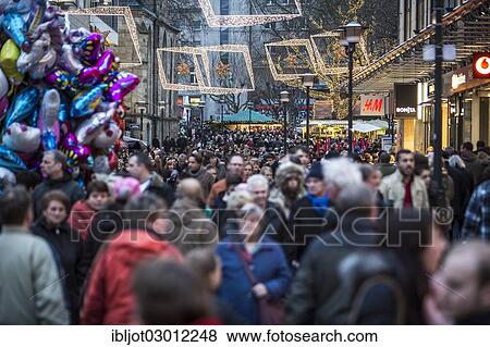 "Crowds thronging between stores and Christmas market stalls, pedestrian street in the centre of Essen, Kettwiger Strasse, Essen, North Rhine-Westphalia, Germany, Europe" View Large Photo Image Stock Photo - "Crowds thronging between stores and Christmas market stalls, pedestrian street in the centre of Essen, Kettwiger Strasse, Essen, North Rhine-Westphalia, Germany, Europe". Fotosearch