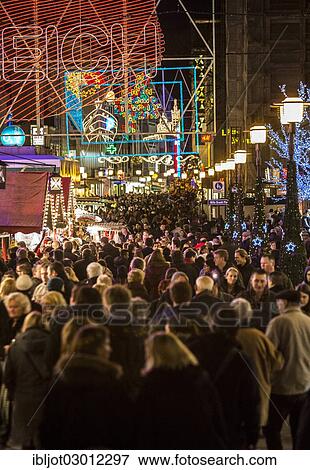 "Crowds thronging between stores and Christmas market stalls, pedestrian street in the centre of Essen, view from Willy-Brandt-Platz towards Kettwiger Strasse, Essen, North Rhine-Westphalia, Germany, Europe" View Large Photo Image Stock Photo - "Crowds thronging between stores and Christmas market stalls, pedestrian street in the centre of Essen, view from Willy-Brandt-Platz towards Kettwiger Strasse, Essen, North Rhine-Westphalia, Germany, Europe". Fotosearch