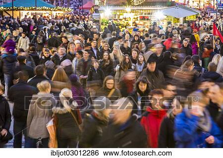 "Crowds thronging between stores and Christmas market stalls, pedestrian street in the centre of Essen, Kettwiger Strasse, Essen, North Rhine-Westphalia, Germany, Europe" View Large Photo Image Stock Photograph - "Crowds thronging between stores and Christmas market stalls, pedestrian street in the centre of Essen, Kettwiger Strasse, Essen, North Rhine-Westphalia, Germany, Europe". Fotosearch